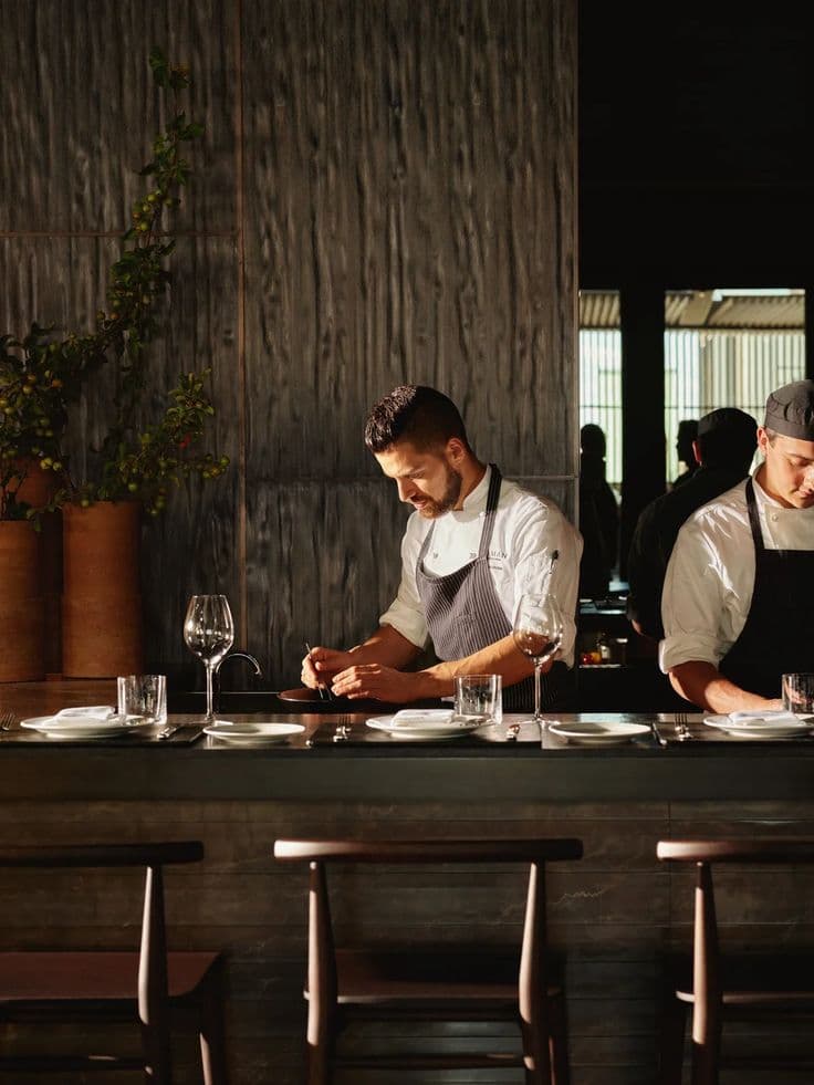 Chef and bar staff working together at a London hospitality venue