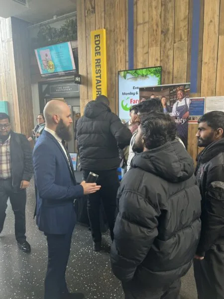 recruiter-talking-to-students-at-hospitality-school